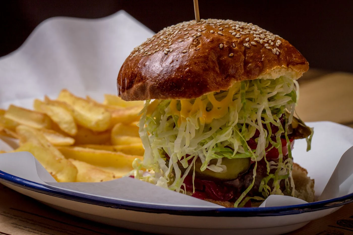Burger served with fries and salad