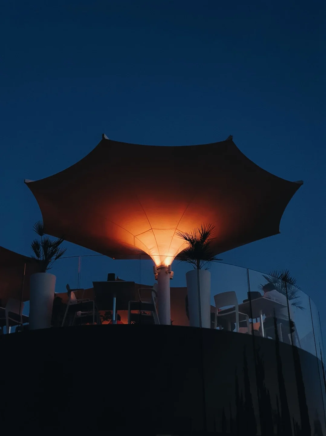 Outdoor terrace with warm evening lighting